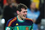 Tears of joy: Spain captain Iker Casillas sinks to his knees at full-time.