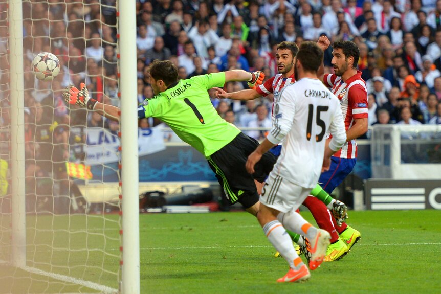 Real Madrid's Iker Casillas fails to stop header by Atletico Madrid's Diego Godin (not pictured).