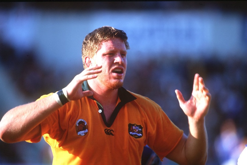 A man prepares for a lineout during a rugby union match