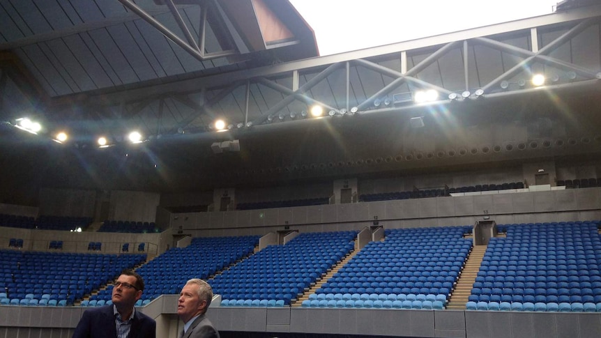 Victorian Premier Daniel Andrews and Tennis Australia CEO Craig Tiley below Margaret Court Arena's closing roof.