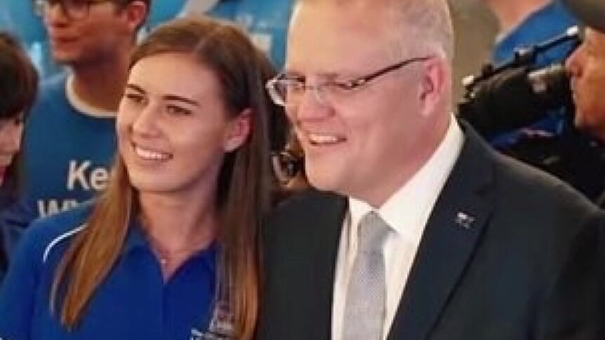 Brittany Higgins poses for a photo with Scott Morrison.