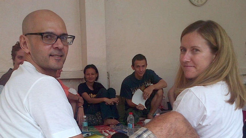 Neil and Tracy Bantleman in sit on the floor of a jail in Jakarta.