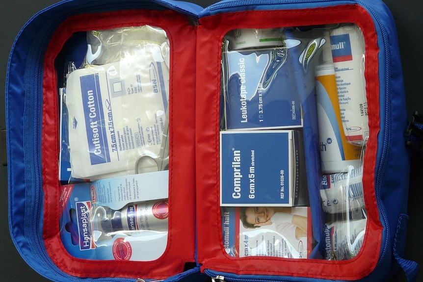 A first aid kit with bandages, bandaids and other equipment.