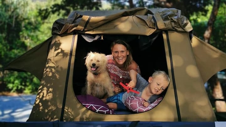 dog in tent with lady and son