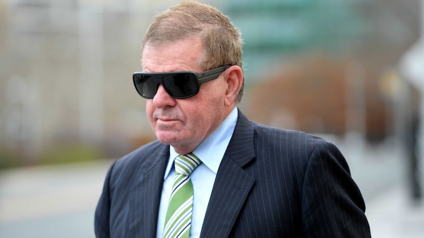 Former parliamentary speaker Peter Slipper arrives at the Magistrates Court in Canberra in July.