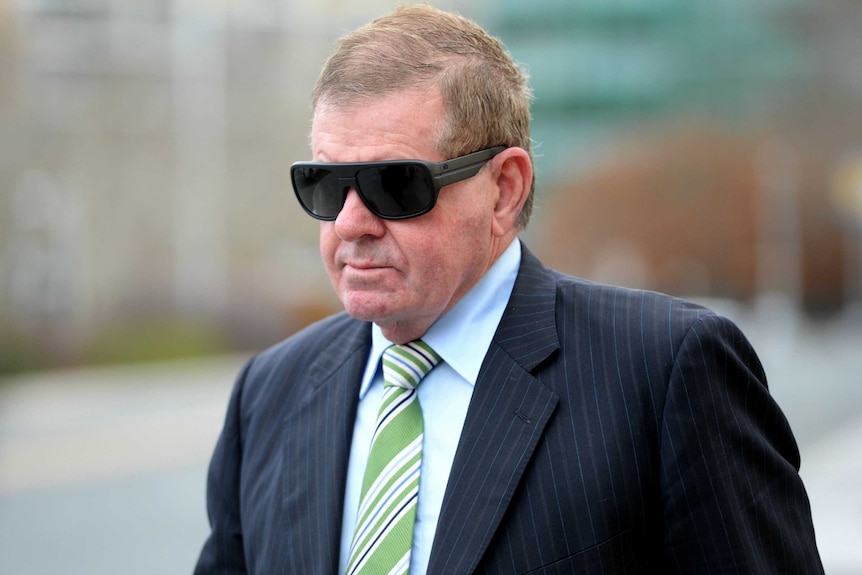 Former parliamentary speaker Peter Slipper arrives at the Magistrates Court in Canberra in July.