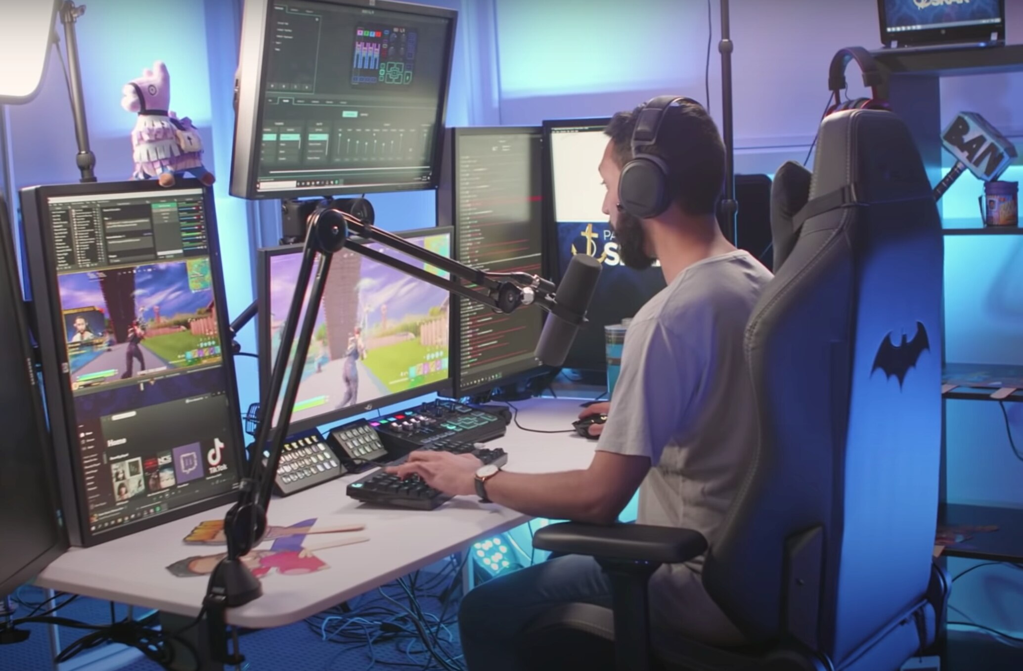 Kiran Skariah sits in a multi-screen home studio and broadcasts to the world.