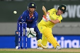 An Australian batter hits the ball through mid-wicket on the leg side during a Women's Cricket World Cup match.