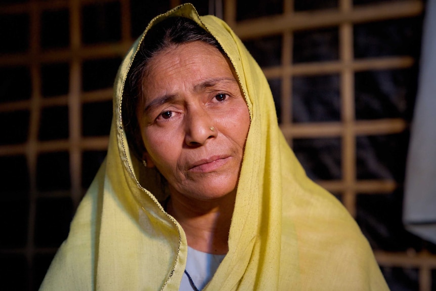 A closeup of Mustafa Khatun with a dejected look on her face.