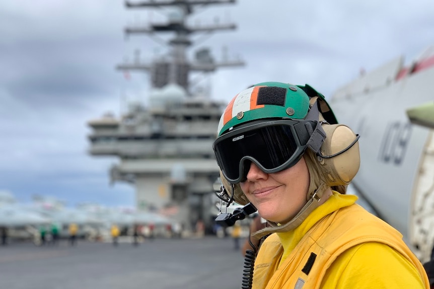 Catapult officer Lieutenant Sarah Klenke stands on the flight deck of the USS Ronald Reagan