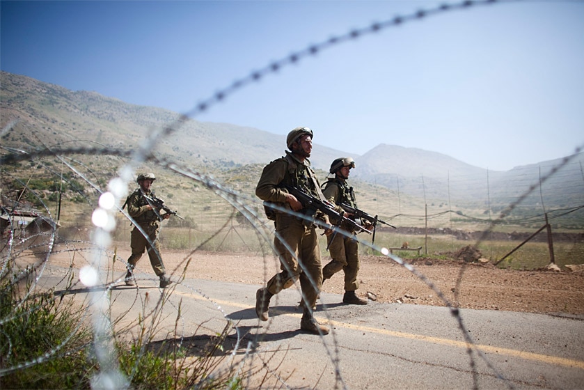 Israeli soldiers operate along Israel's border with Syria.