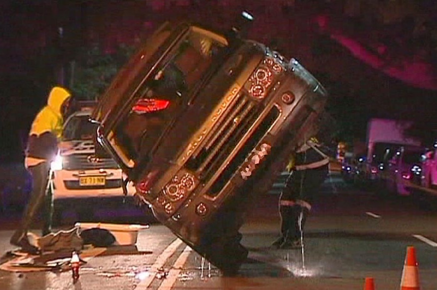The Range Rover of Jodhi Meares is righted after she crashed it into three cars and rolled it.