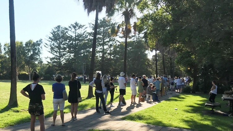 A queue of people outside.