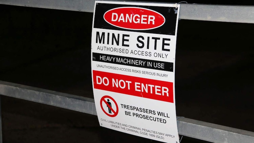 Keep out signage at night at Adani's Carmichael coal mine site in central Queensland.