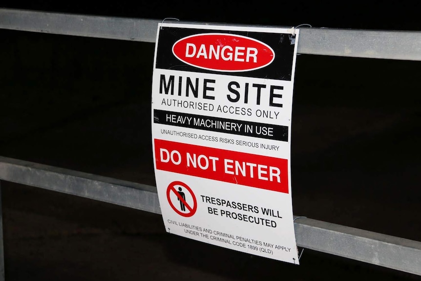 Keep out signage at night at Adani's Carmichael coal mine site in central Queensland.