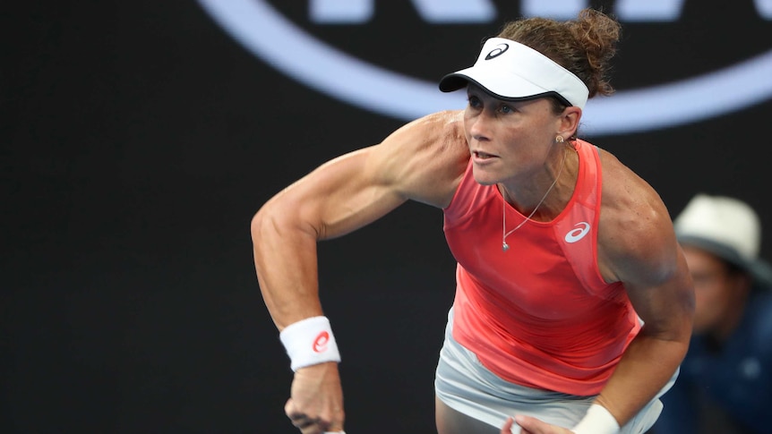 Samantha Stosur serves during the first round of the Australian Open