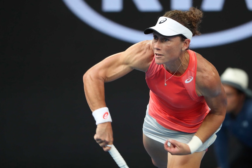 Samantha Stosur serves during the first round of the Australian Open