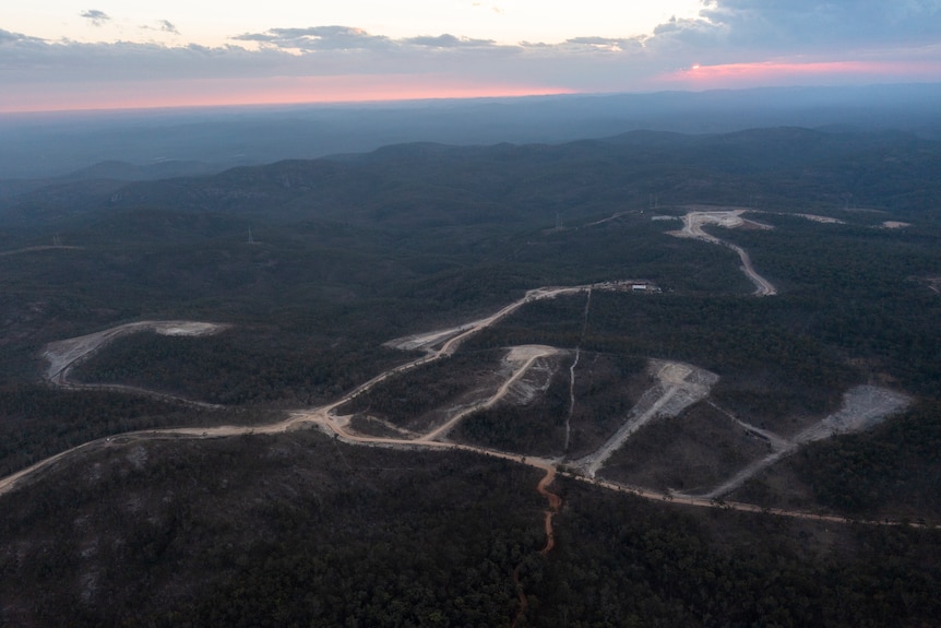 An aerial view showing roads and turbine pads.