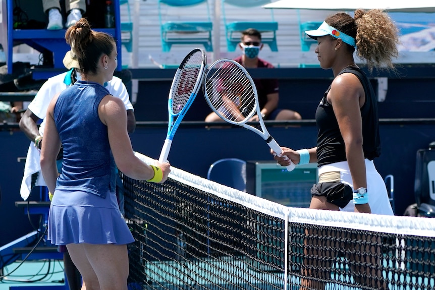 Maria Sakkari and Naomi Osaka meet at the net at the Miami Open