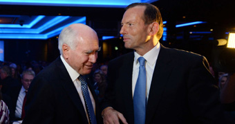 John Howard and Tony Abbott speak at a Liberal Party fundraising dinner in Sydney.