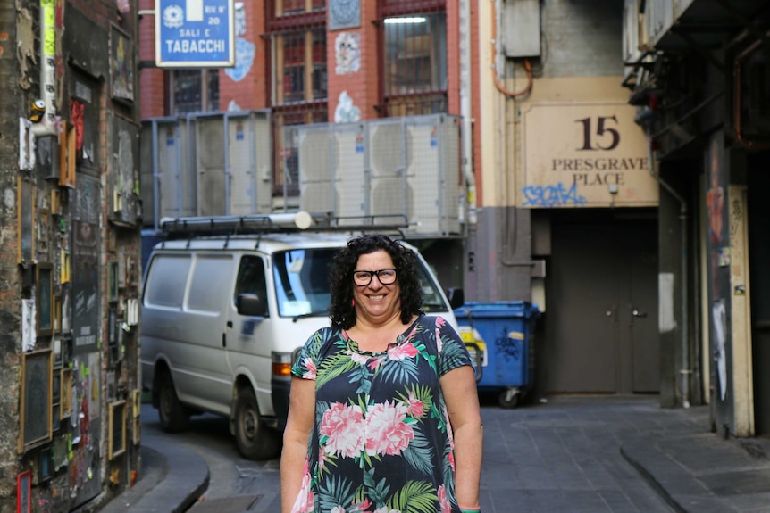 A woman poses in one of Melbourne's laneways