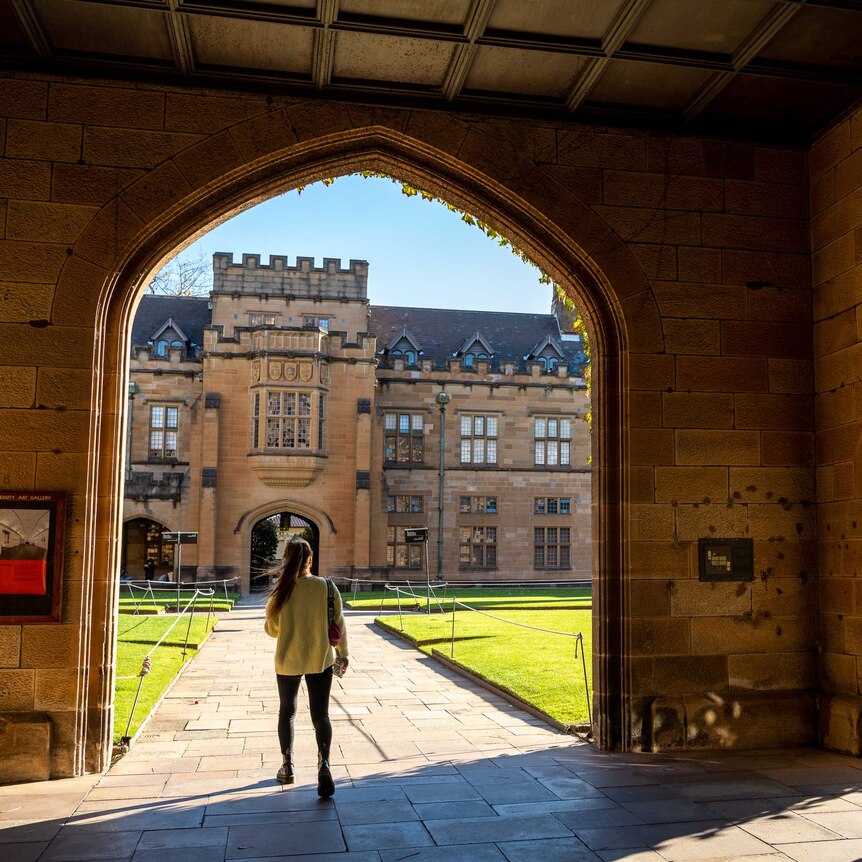 A university in Sydney, a woman is pictured walking through an archway