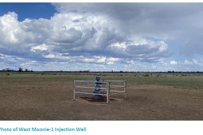 A photo of a small fence around the pipe-metal well head of the CTSco waste CO2 injection well near Moonie, from the CTSco EIS.