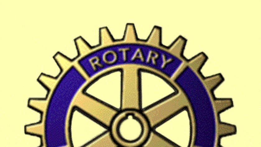 Rotary International logo on a yellow background