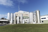 Large factory plant Fonterra milk processor with large steel tanks.