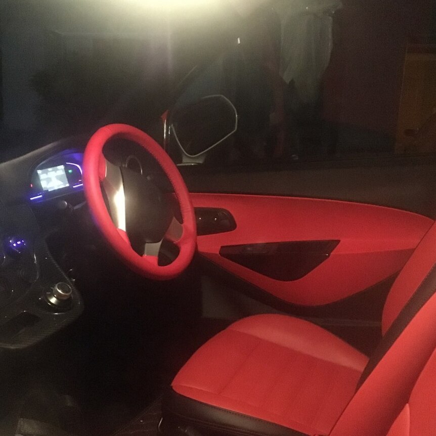 The front seat, steering wheel and dashboard of a car