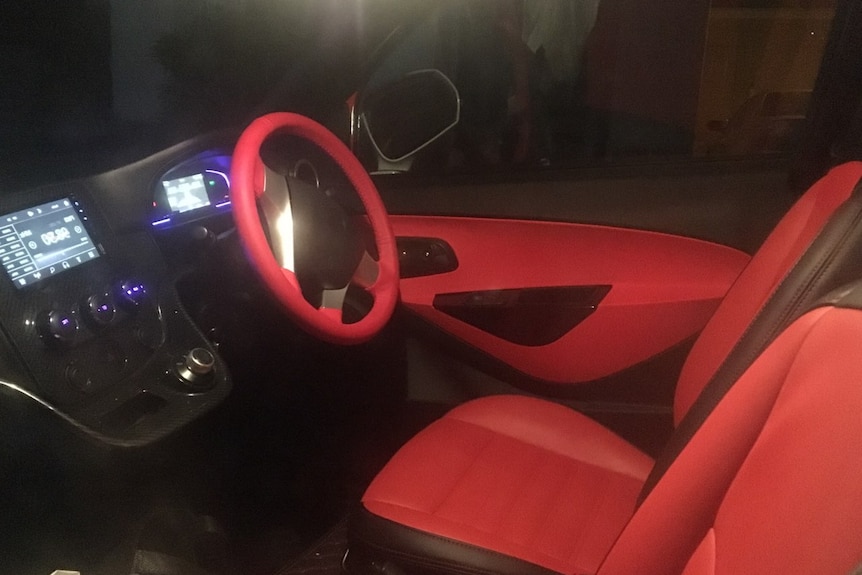 The front seat, steering wheel and dashboard of a car