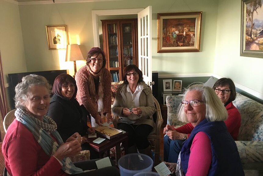 Six women sit in a lounge room in country South Australia