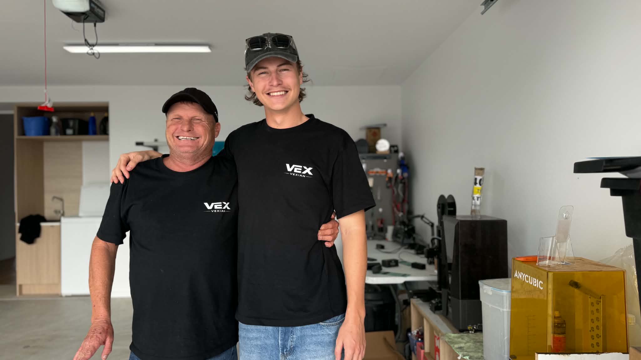 Two men smiling in garage