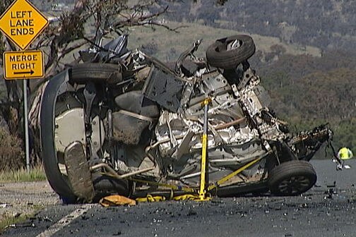Remains of a car involved in a head-on collision with a timber truck on Monaro Highway, Canberra