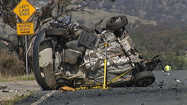 Remains of a car involved in a head-on collision with a timber truck on Monaro Highway, Canberra