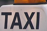 A sign on top of a Sydney taxi