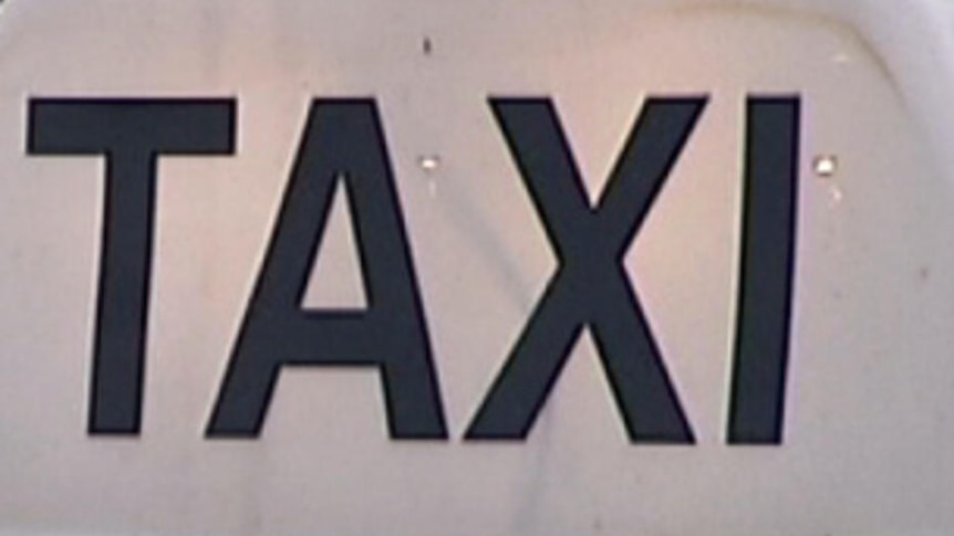 A sign on top of a Sydney taxi