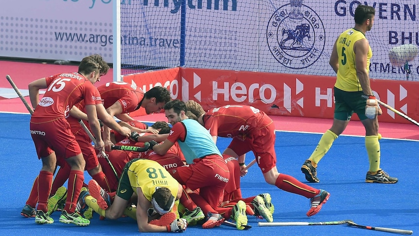 Belgian players celebrate a goal against Australia at the 2014 Champions Trophy in India.