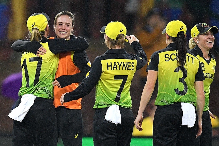 An injured player hugs her skipper after Australia makes the final of the Women's T20 World Cup.