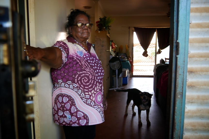 Kathy Watson, standing by door, May 2022