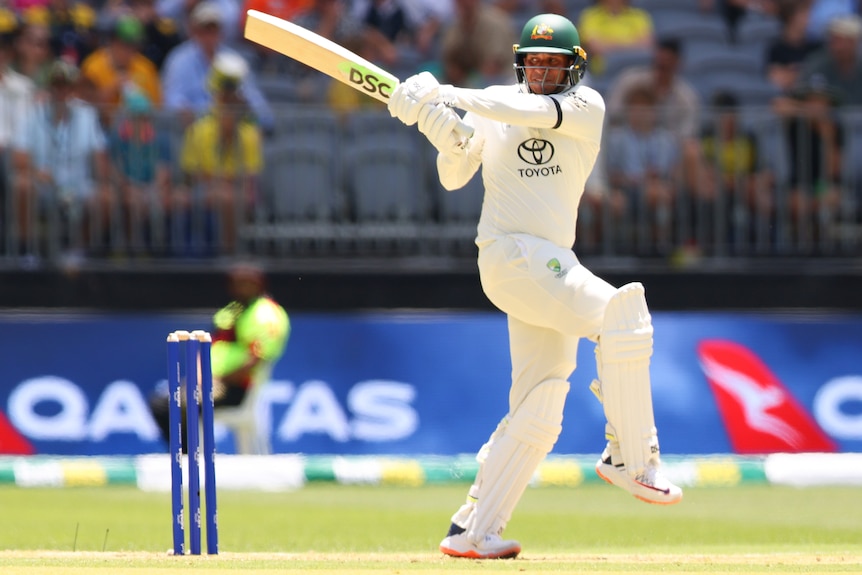 Usman Khawaja plays a pull shot during first Test against Pakistan in Perth.