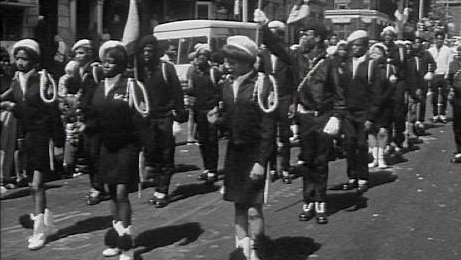 African-American marching band in street