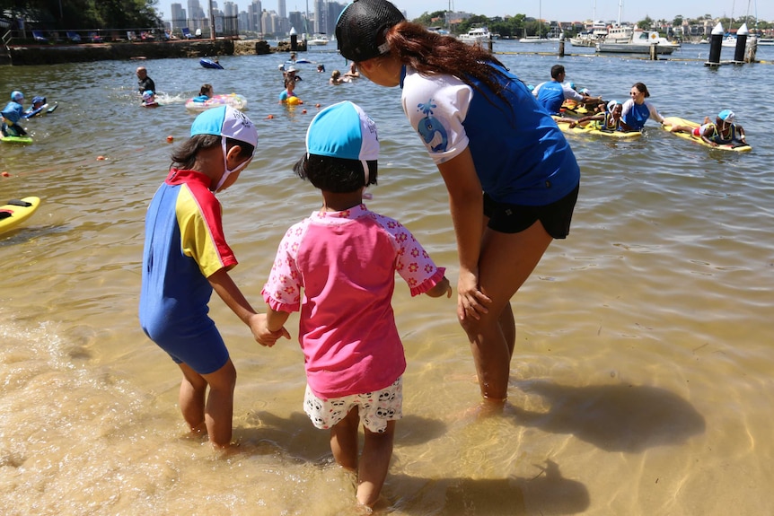 Refugee kids get ready to swim at Greenwich baths