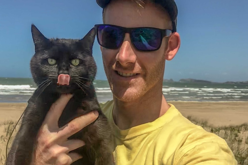 Richard East pictured with his cat Willow for story about travelling Australia with pets