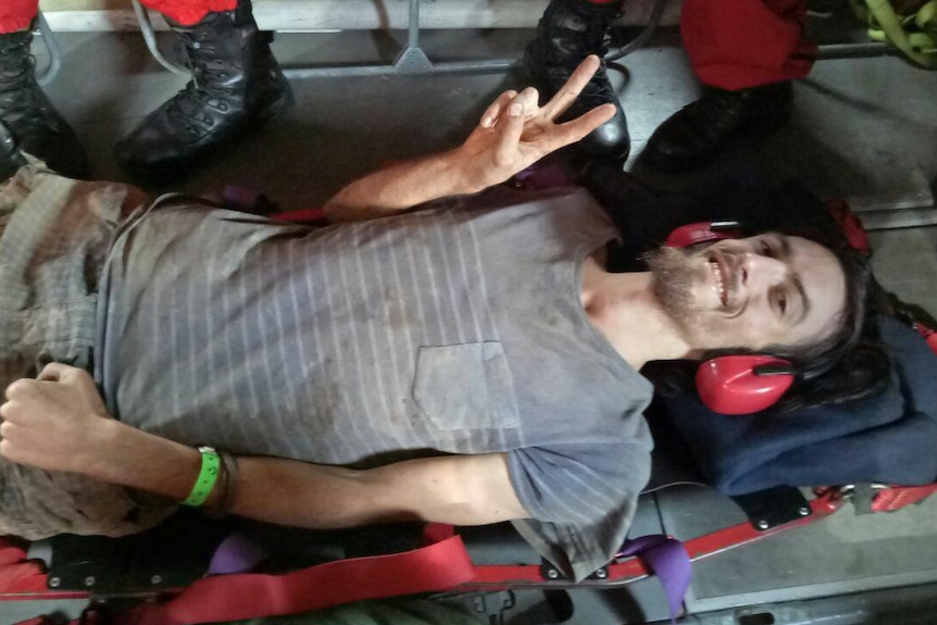 Rescued hiker Andrew Gaskell on a Malaysian plane