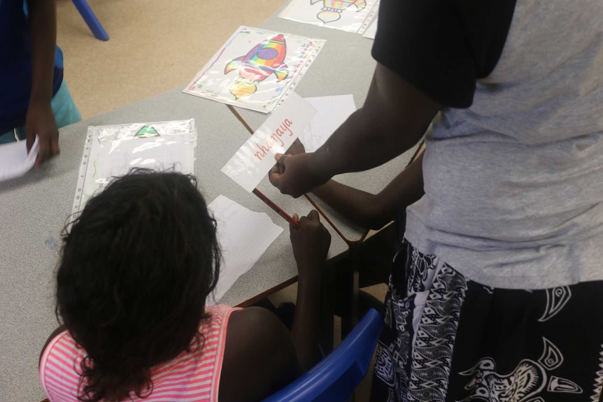 A teacher and student at Yirrkala school