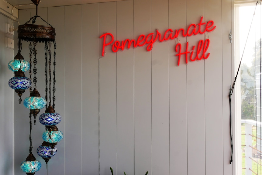 LED lights that say 'Pomegranate Hill'