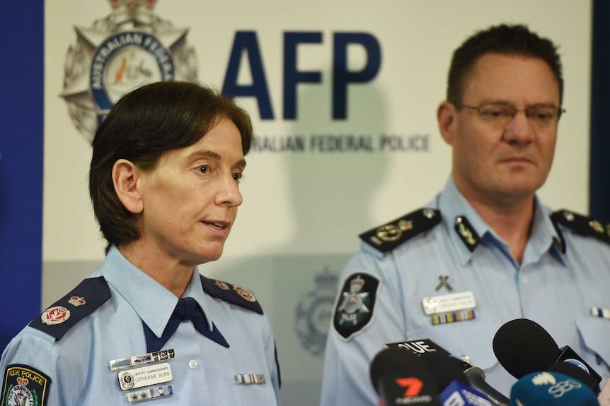 NSW Police Deputy Commissioner Catherine Burn (left) and Australian Federal Police Deputy Commissioner Michael Phelan (right)