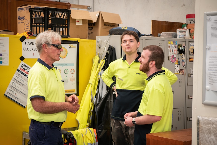 Josh Turner chatting with colleagues at the depot