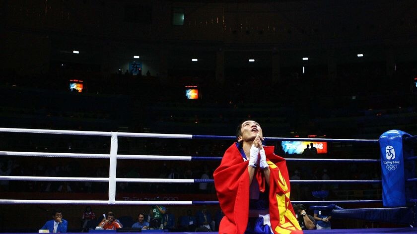 Mongolia's Badar-Uugan Enkhbat celebrates winning gold